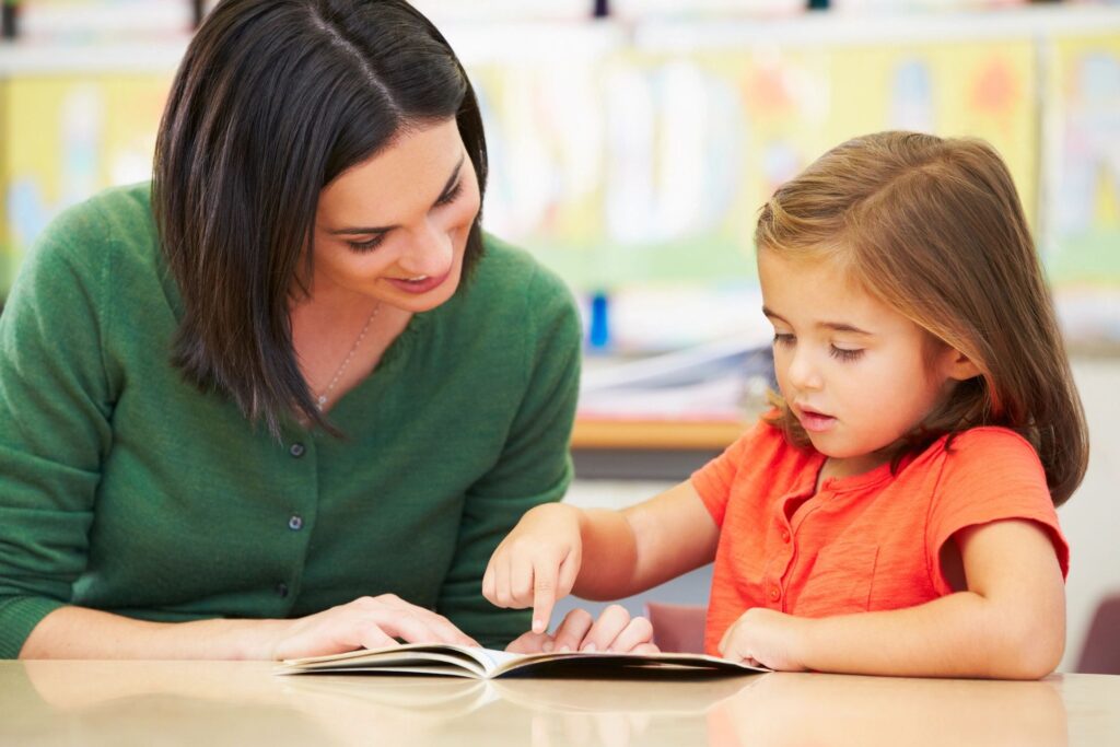 Mom teaching daughter how to develop communication skills